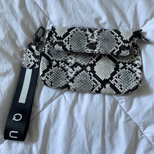 Quay snake print wristlet,